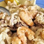 Ristorante di pesce con vista mare in Puglia, piatti freschi e atmosfera accogliente.